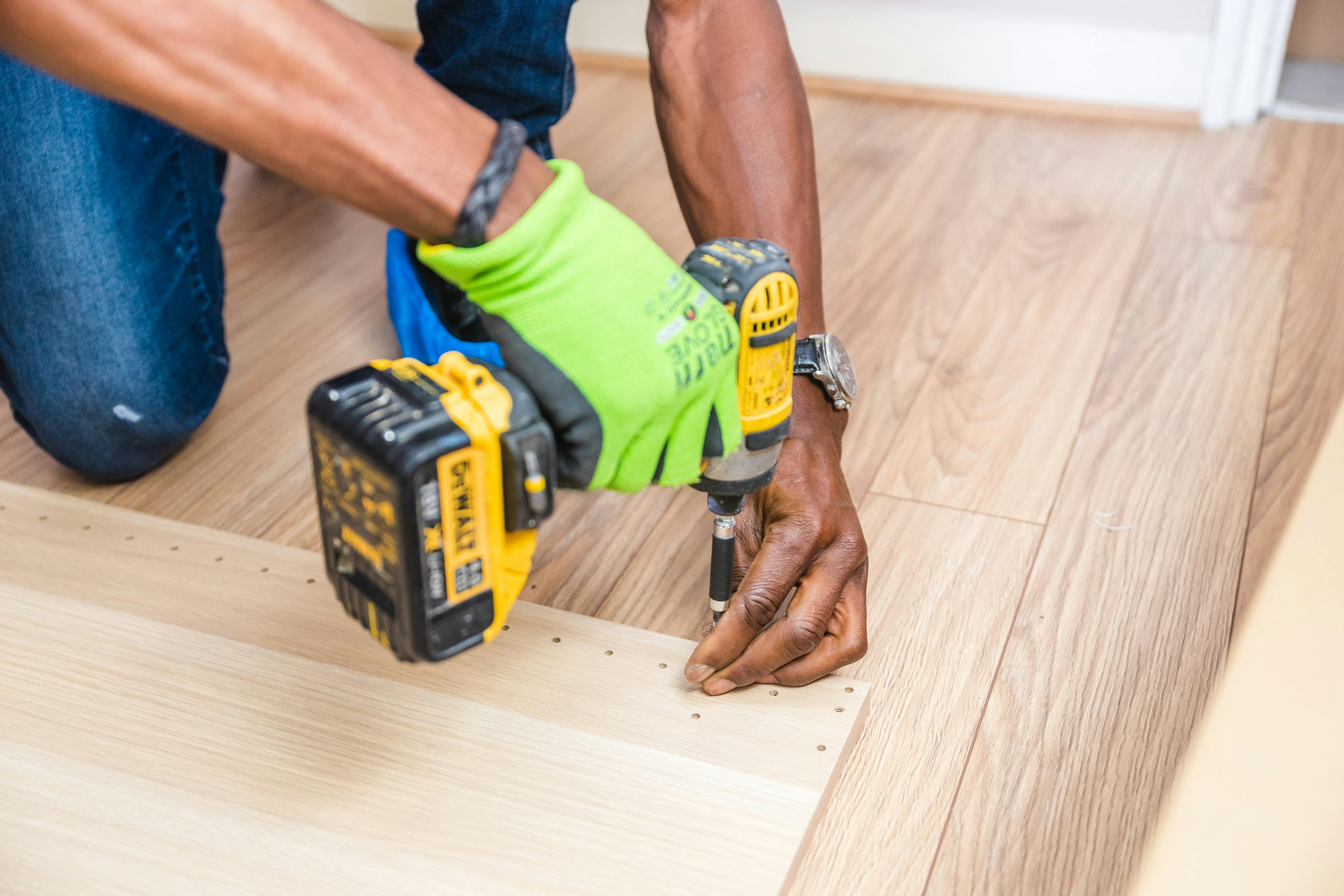 Handyman assembling furniture